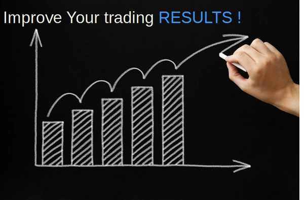 Hand drawing an upward bar chart on a blackboard.