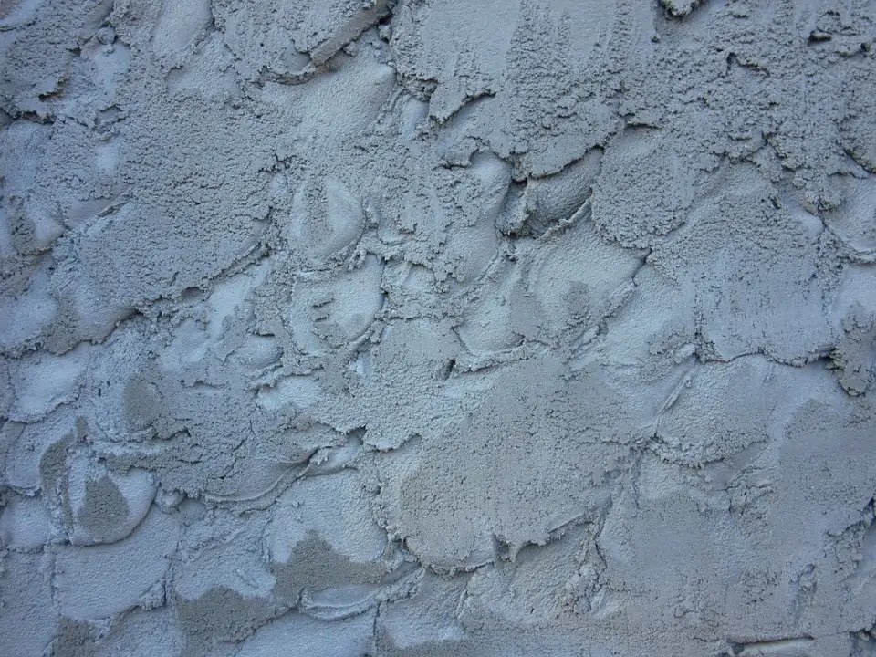 Close-up texture of freshly applied plaster on a wall.
